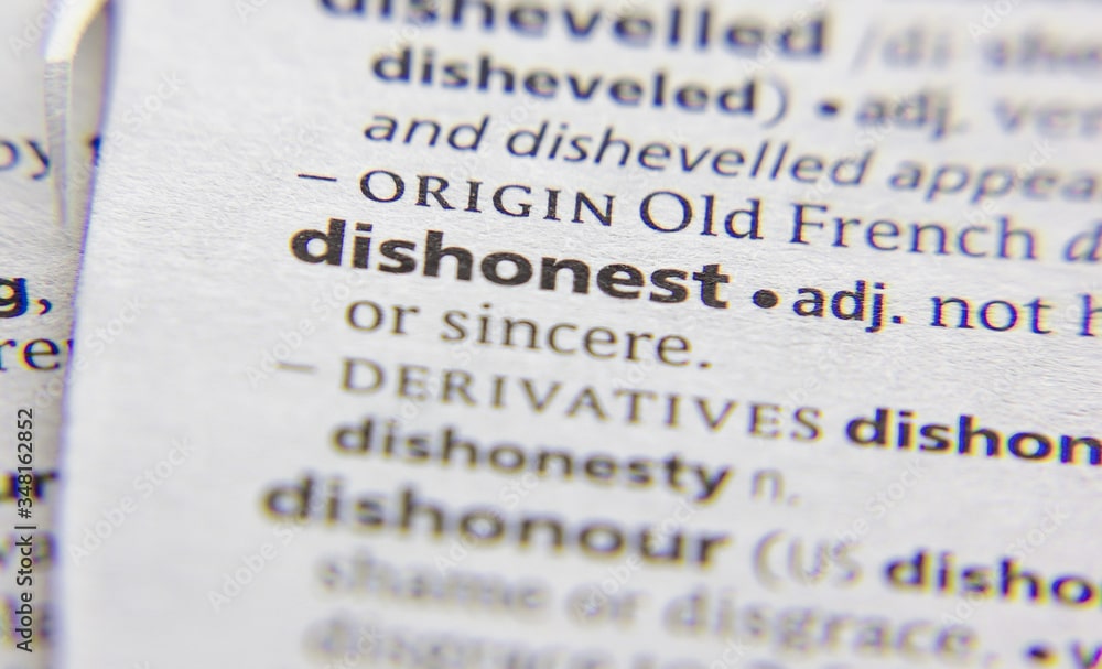 Dishonest word or phrase in a dictionary symbolizing how Capital One treated its customers by switching us to lower interest accounts.