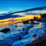 beach sunset possible through reading a financial freedom blog like Think and Talk Money.