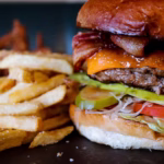 Bacon Cheeseburger and Fries, illustrating two friends talking about if money was no obstacle as learned on Think and Talk Money