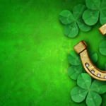 Saint Patricks Day lucky charms as green shamrock and a horse shoe as a clover leaf background as a St Patrick celebration symbol and seasonal spring icon of Irish tradition celebration illustrating that there's nothing wrong with benefiting from luck when it comes to personal finance and Think and Talk Money.