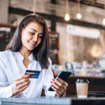 Paying for coffee with a credit card after learning ten credit card tips for lawyers and professionals on Think and Talk Money.