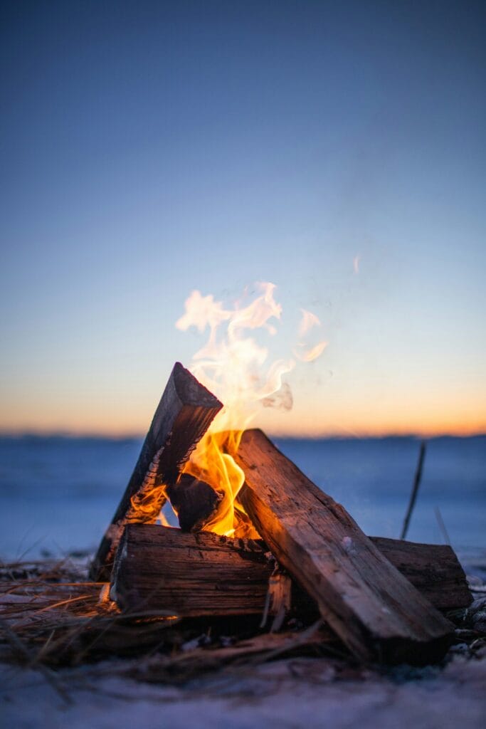Fire burning on beach, depicting the FIRE movement: Financial Independence, Retire Early instead of FIPE: Financial Independence, Pivot Early.