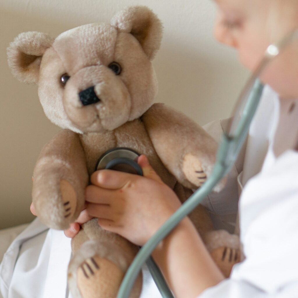 Physical examination by a Children's Doctor. Teddy's medical check up, illustrating that years from now you can use your HSA to reimburse yourself for prior medical expenses after benefiting from triple tax benefits.