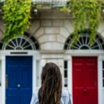 Whether to invest while in debt is a tricky question. I like to do both for 4 main reasons, allocating 75% of my available funds to debt and 25% to investments. You don't have to choose one door or the other.