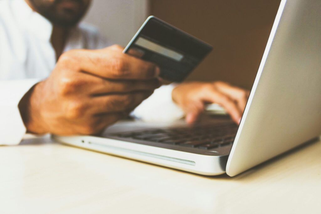Stock photo of the Business Man with a credit card by rupixen illustrating why I'm keeping the Chase Sapphire Reserve in my wallet despite the higher annual fee.
