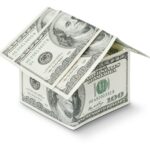 Symbolic house made from one hundred dollars isolated on white background illustrating that real estate can accelerate your journey to financial freedom.