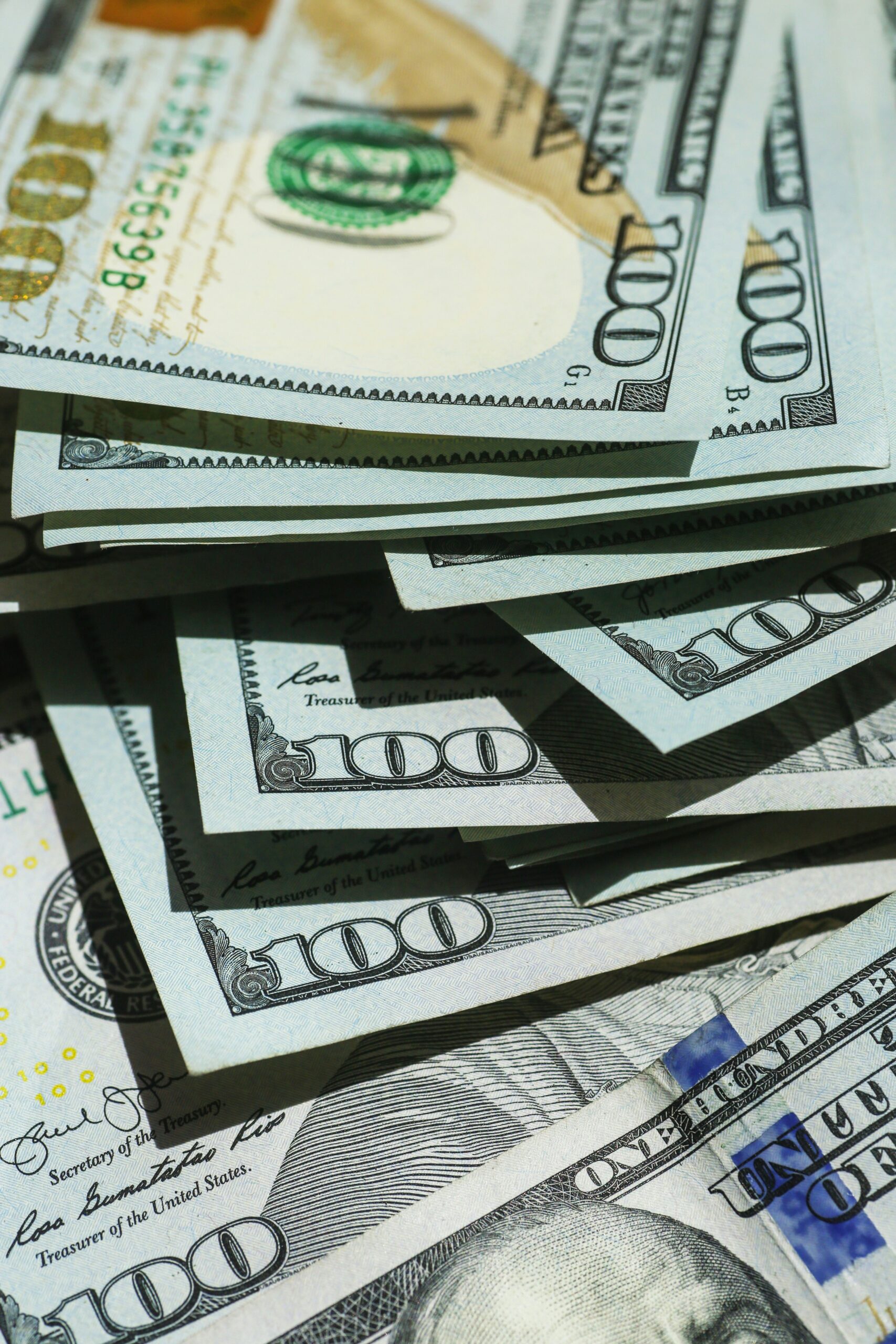 one hundred dollar bills symbolizing the question of what would you do if you woke up tomorrow with $10 million.