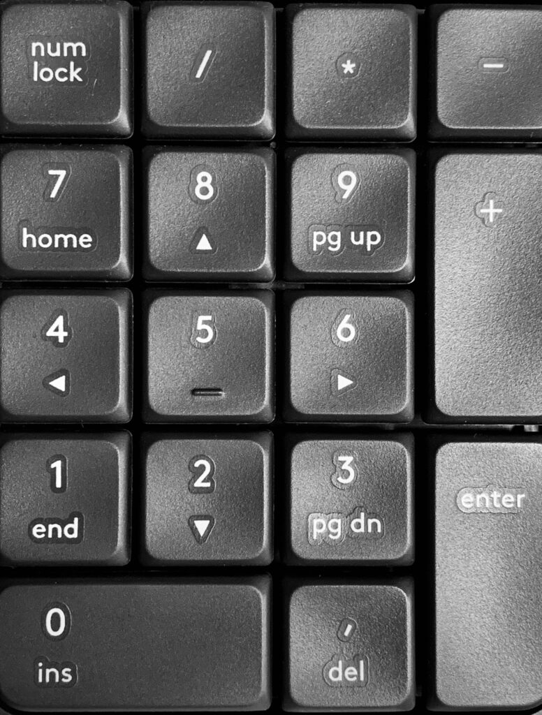black computer keyboard number pad indicating how easy it is to run the numbers on real estate deals.