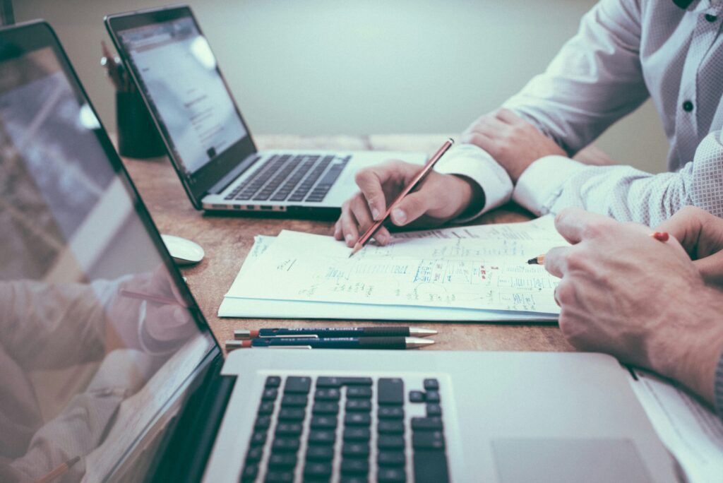Brainstorming over paper representing having a good real estate accountant on your team.