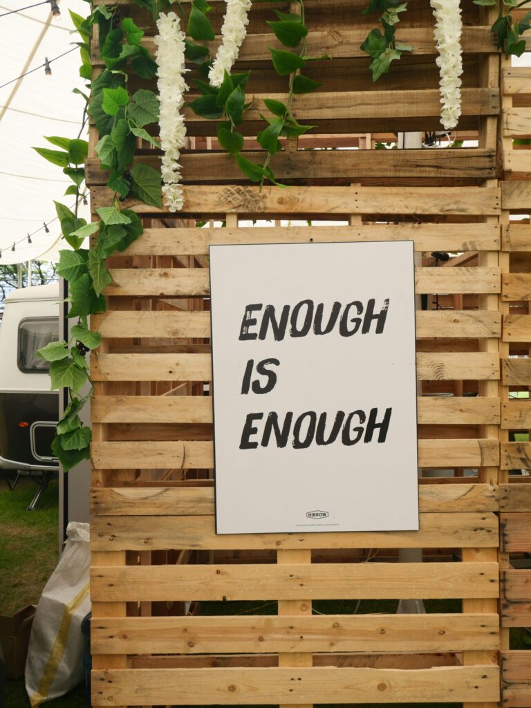 a sign that says enough is enough indicating when you have enough saved for retirement you can pivot to other pursuits because of Coast FIRE.