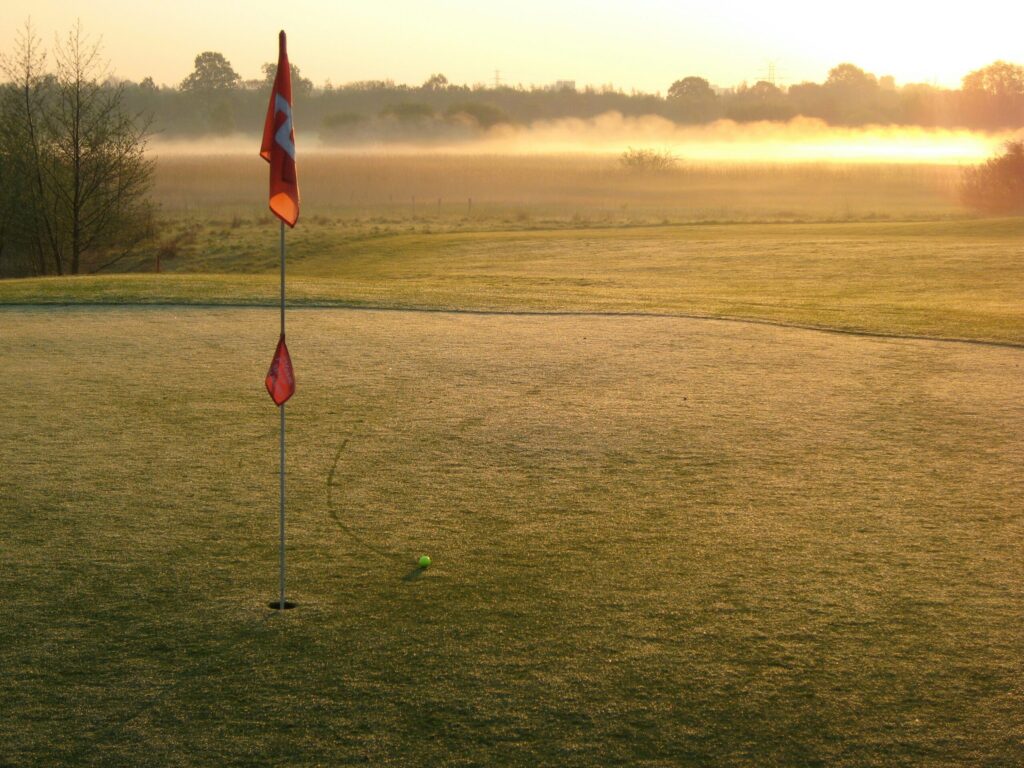 golf course with flag stick indicating what I'll buy when I'm out of debt.