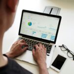 person using lap top to quickly and run the numbers on a real estate deal.