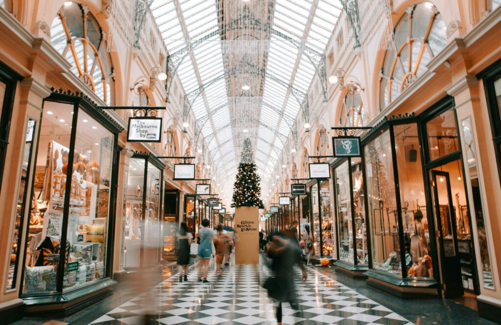 person walking inside shopping center showing that we all have choices to make when it comes to our spending.