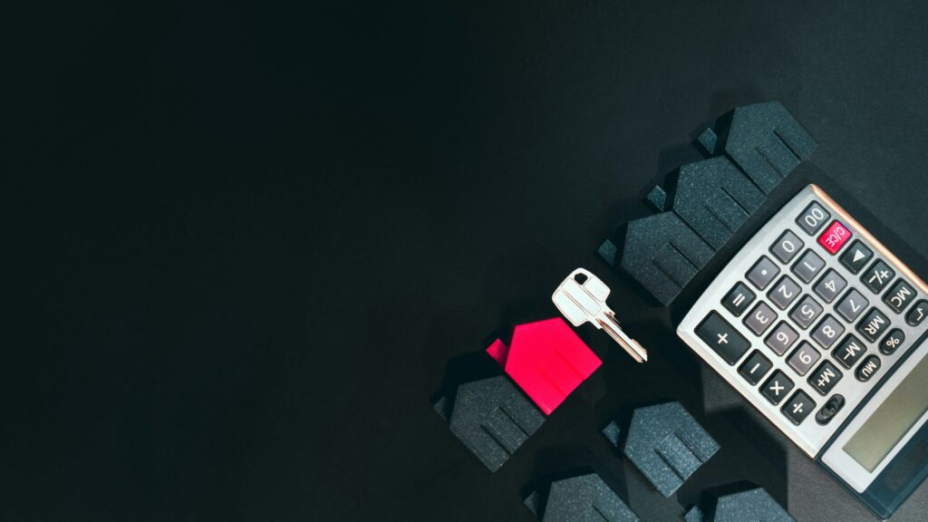 Real estate business finance background template. Calculator door key indicating the hardest part to buying real estate is coming up with the down payment.