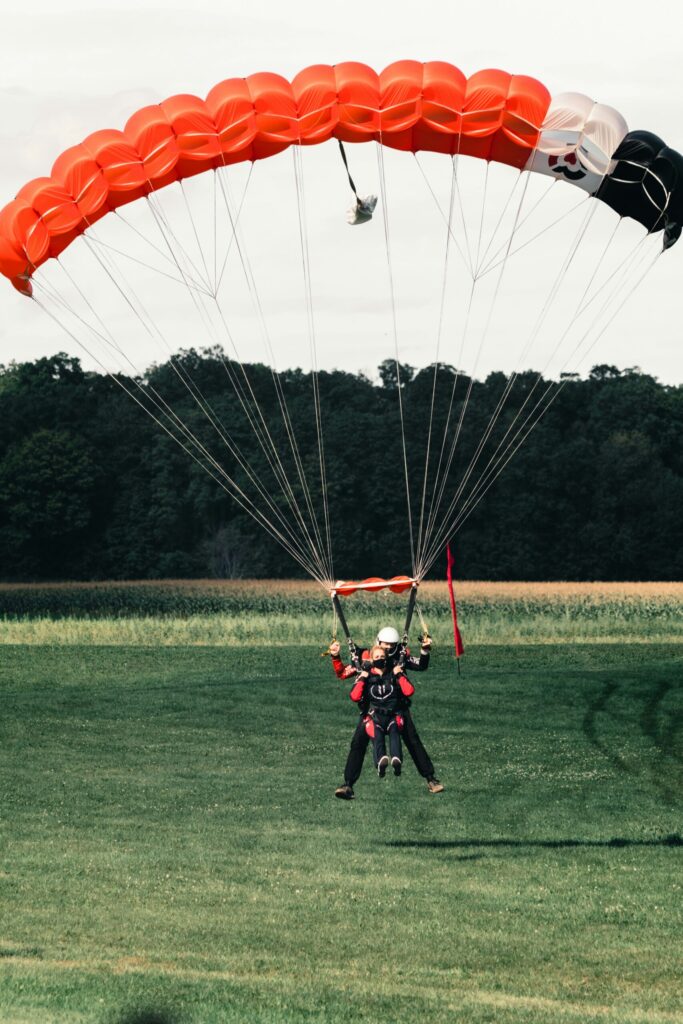The perfect landing with a parachute indicating the importance of having parachute money through real estate and the stock market.