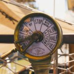 a close up of a clock on a pole representing what we can control in life like our saving rate.