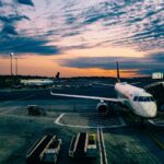 Airport in the evening signifying that you should select one airline that partners well with your credit card.