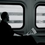 Lonesome traveler looking out the window and wondering how much money he will keep this week.