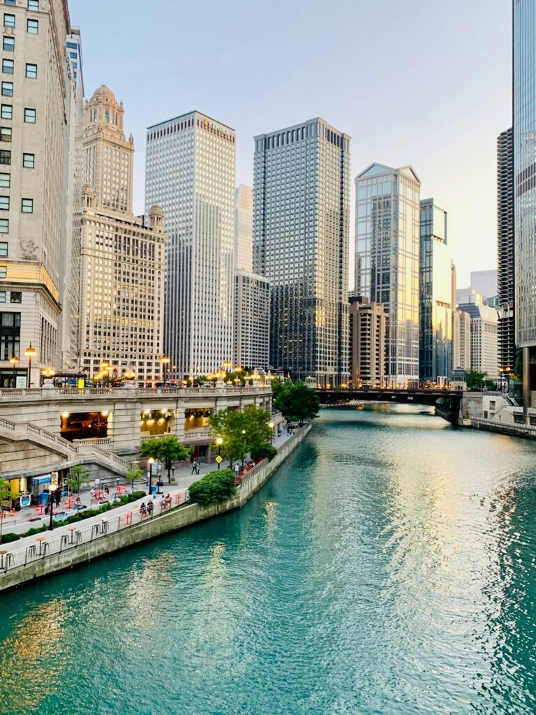 chicago river with buildings indicating the town that I want to buy real estate in.