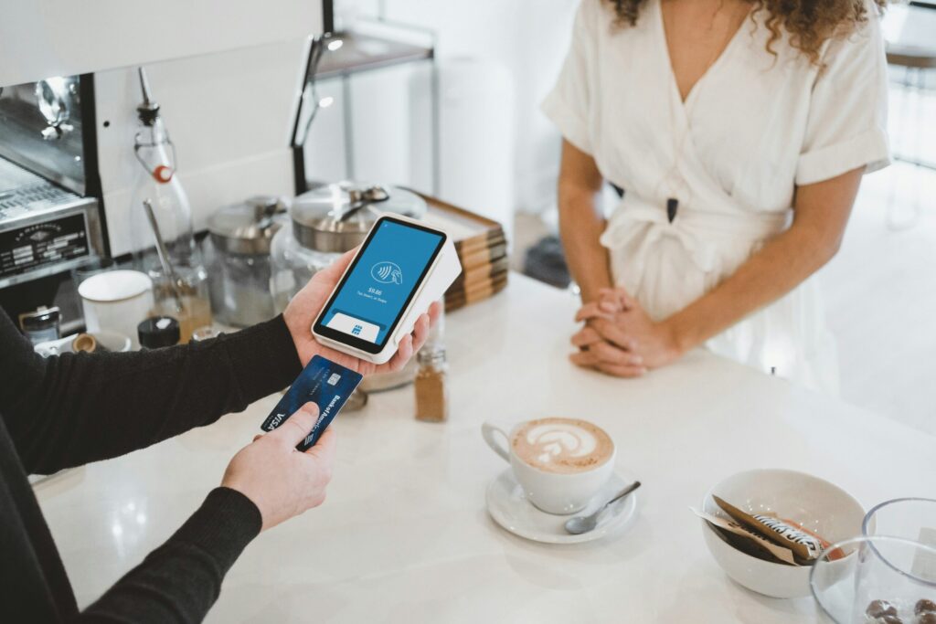 woman standing and holding credit card to get points for travel not cash back.