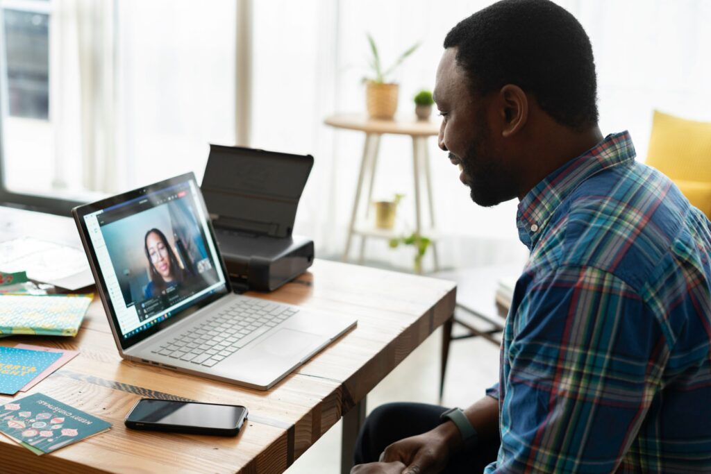 A landlord working in an office on a virtual call interviewing a prospective tenant because choosing your tenants wisely is critically important.