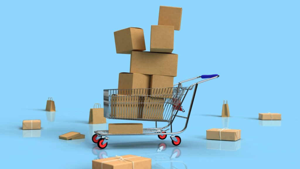 a toy shopping cart with boxes piled up indicating we should spend money based on our wealth not our income.