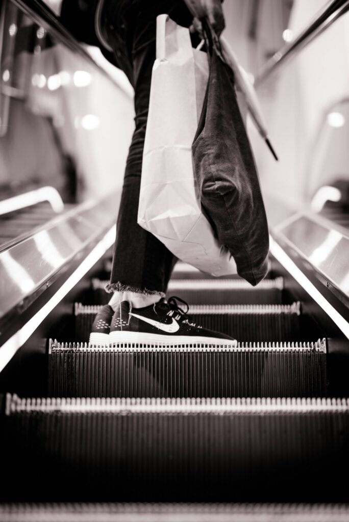 black and white low top sneakers indicating the credit card tip of not letting the banks get richer off of you.