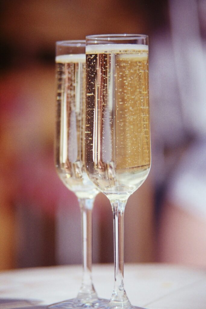 clear wine glass holding champagne, one of the best memories I have with my mom and spent money on.