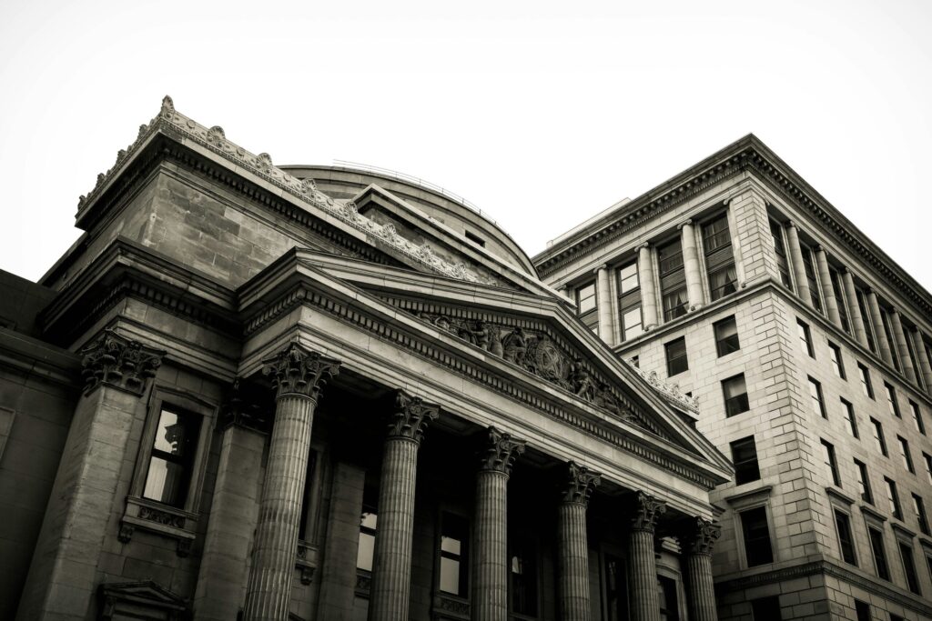 columns on montreal building indicating whether you want the bank to get rich or you to get rich from using credit cards.