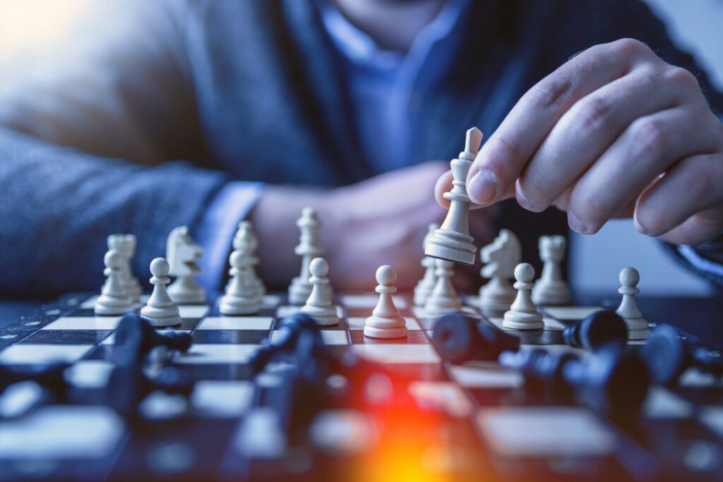 man playing chess showing the 10 tips for lawyers and professionals to pay off debt.
