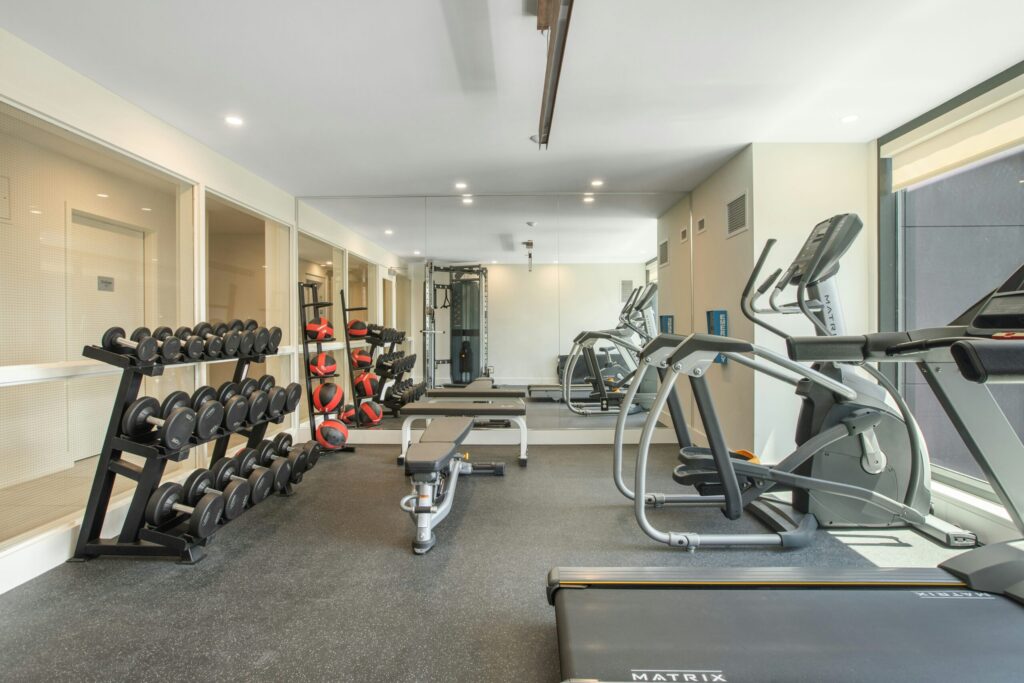 exercise equipment inside a typical condo building showing an amenity that you probably won't use very often and why you shouldn't buy a cute condo.