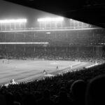 Hazy nighttime Cubs game at Wrigley Field indicating some of the best memories I've had and spent money on.