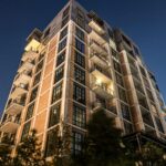 low angle photo of buildings representing a cute condo that you should not buy as a starter home.