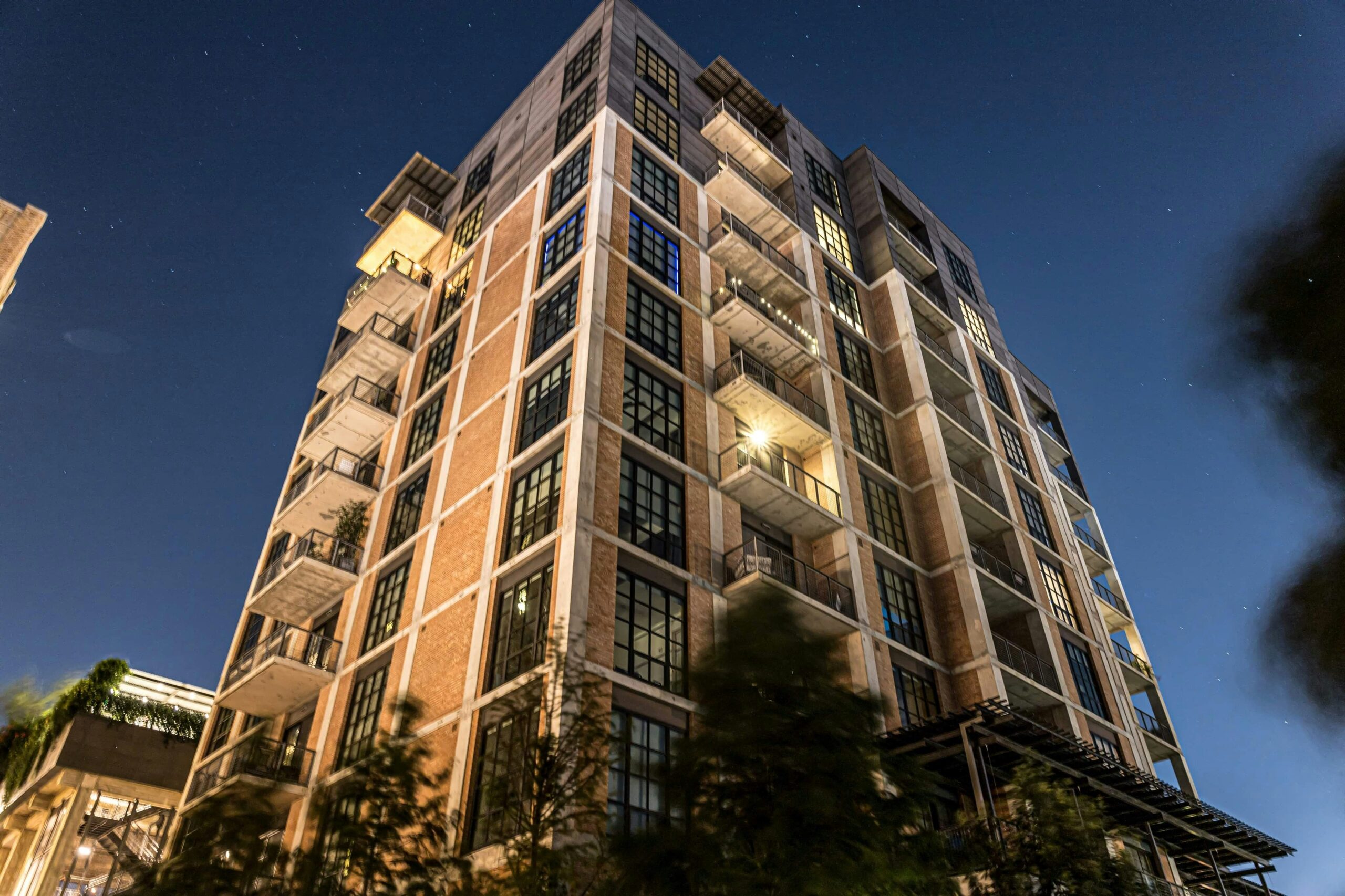 low angle photo of buildings representing a cute condo that you should not buy as a starter home.