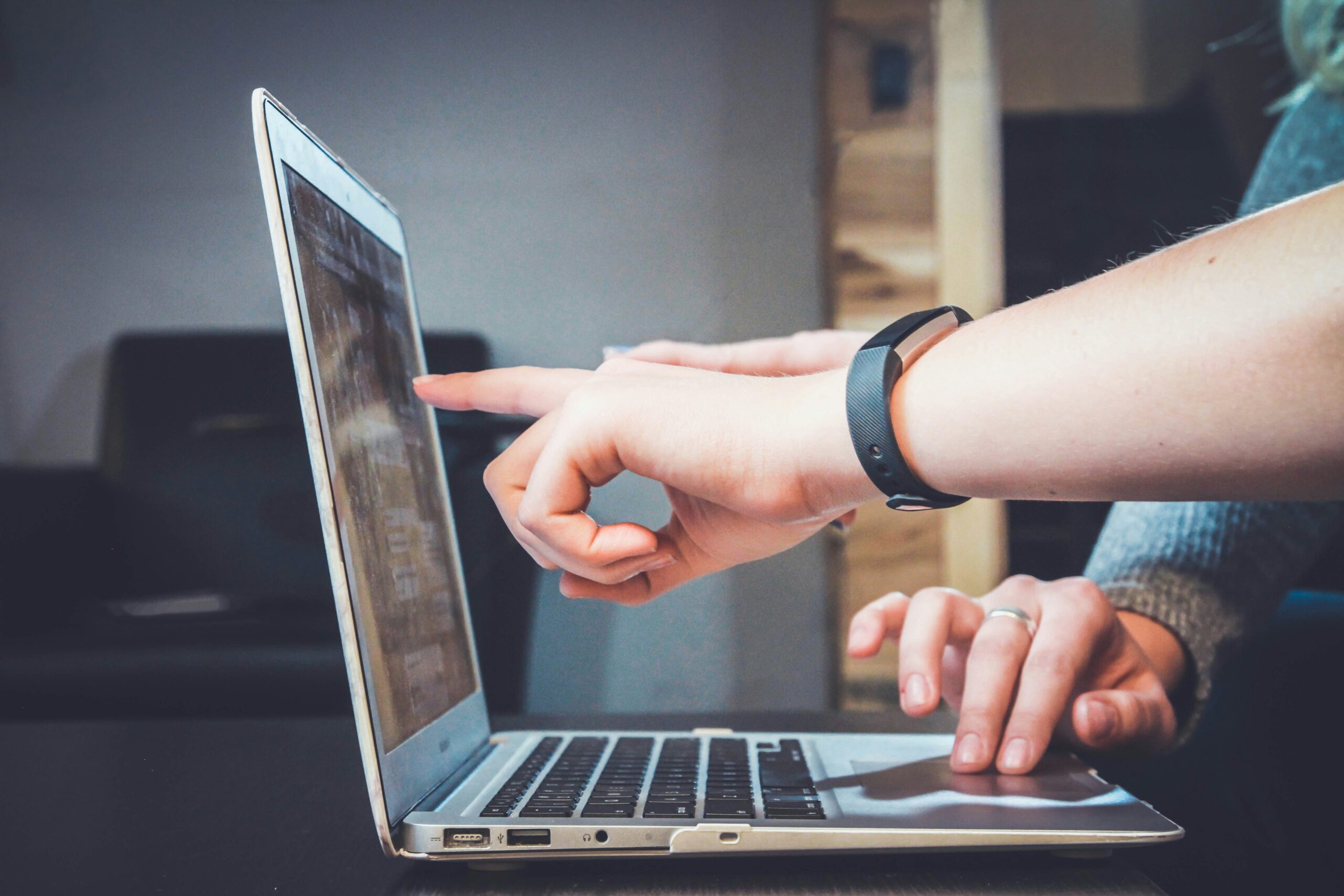 looking at computer to show top 10 tips to pay off debt for lawyers and professionals.