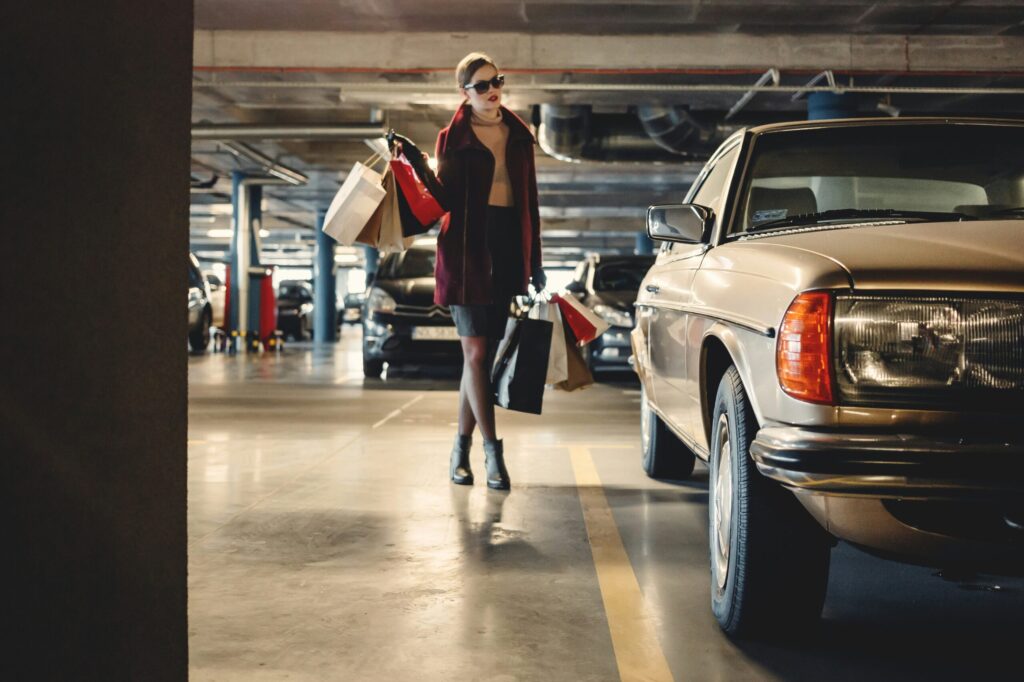 Woman shopping car indicating we should spend money based on our wealth not our income.