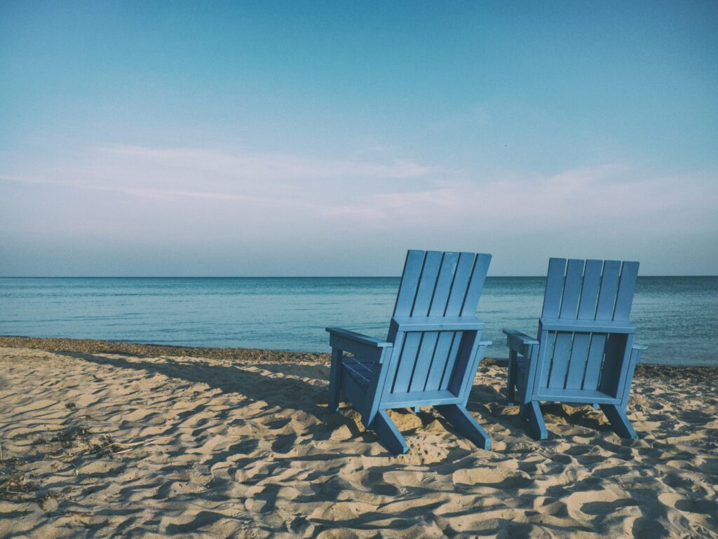 Adirondack chairs representing retirement and that you still have time to meet your 2025 retirement goals.