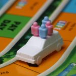 Game of life close-up illustrating that we can turn negative money experiences into positives by playing The Game of Big Expenses.