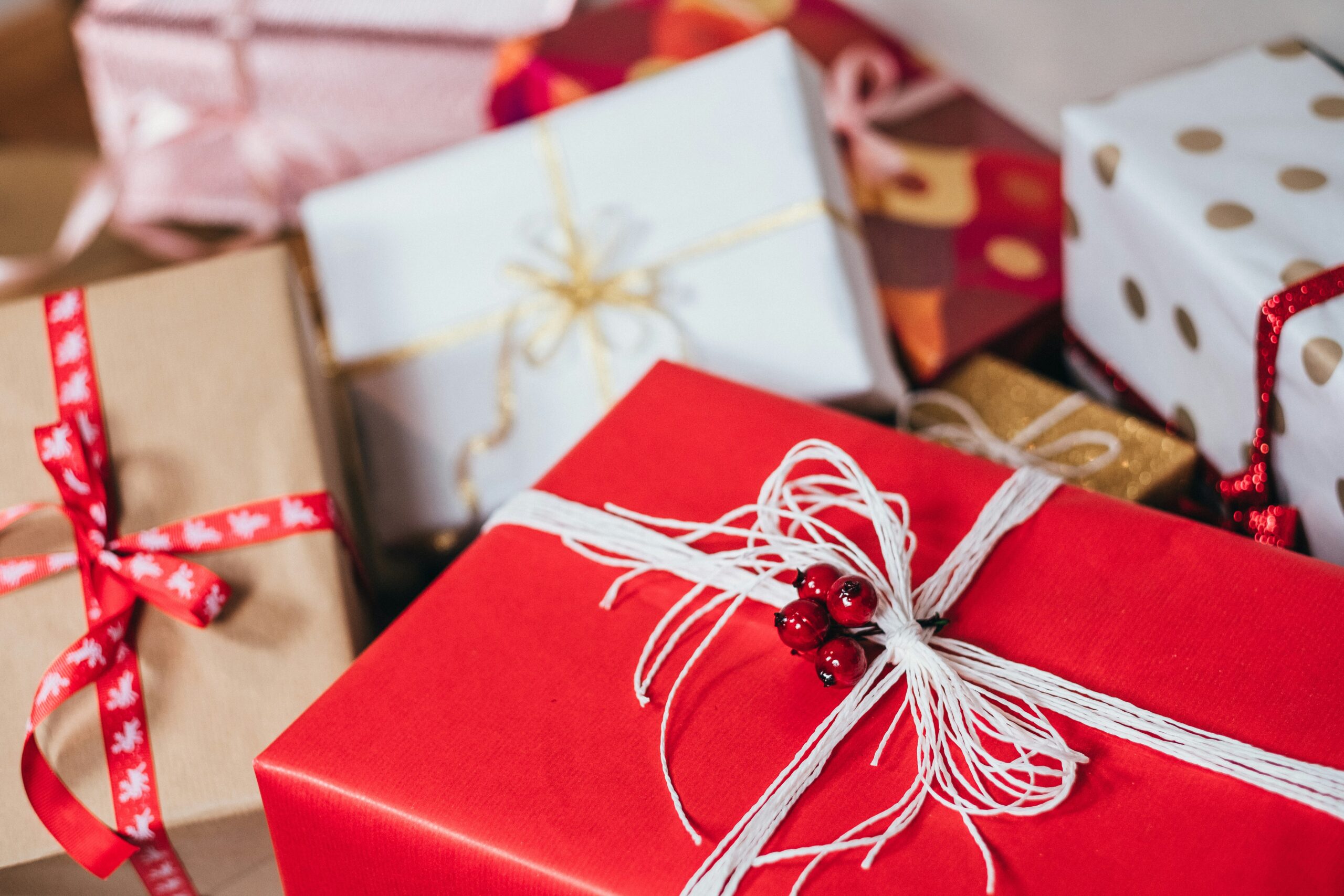 gift boxes illustrating the challenges of staying on budget during the holiday season and why you need my four tips to stay on budget for the holiday season.