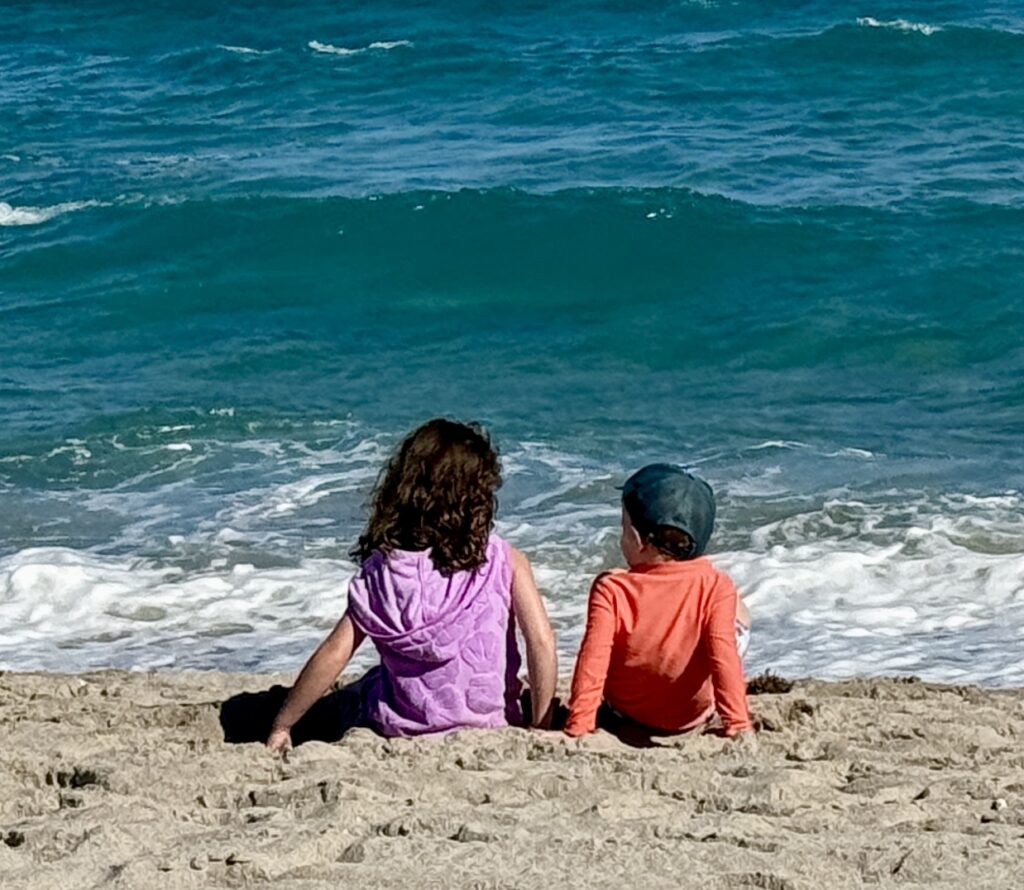 two kids looking at the ocean reminding me to refocus my best energy on my family.